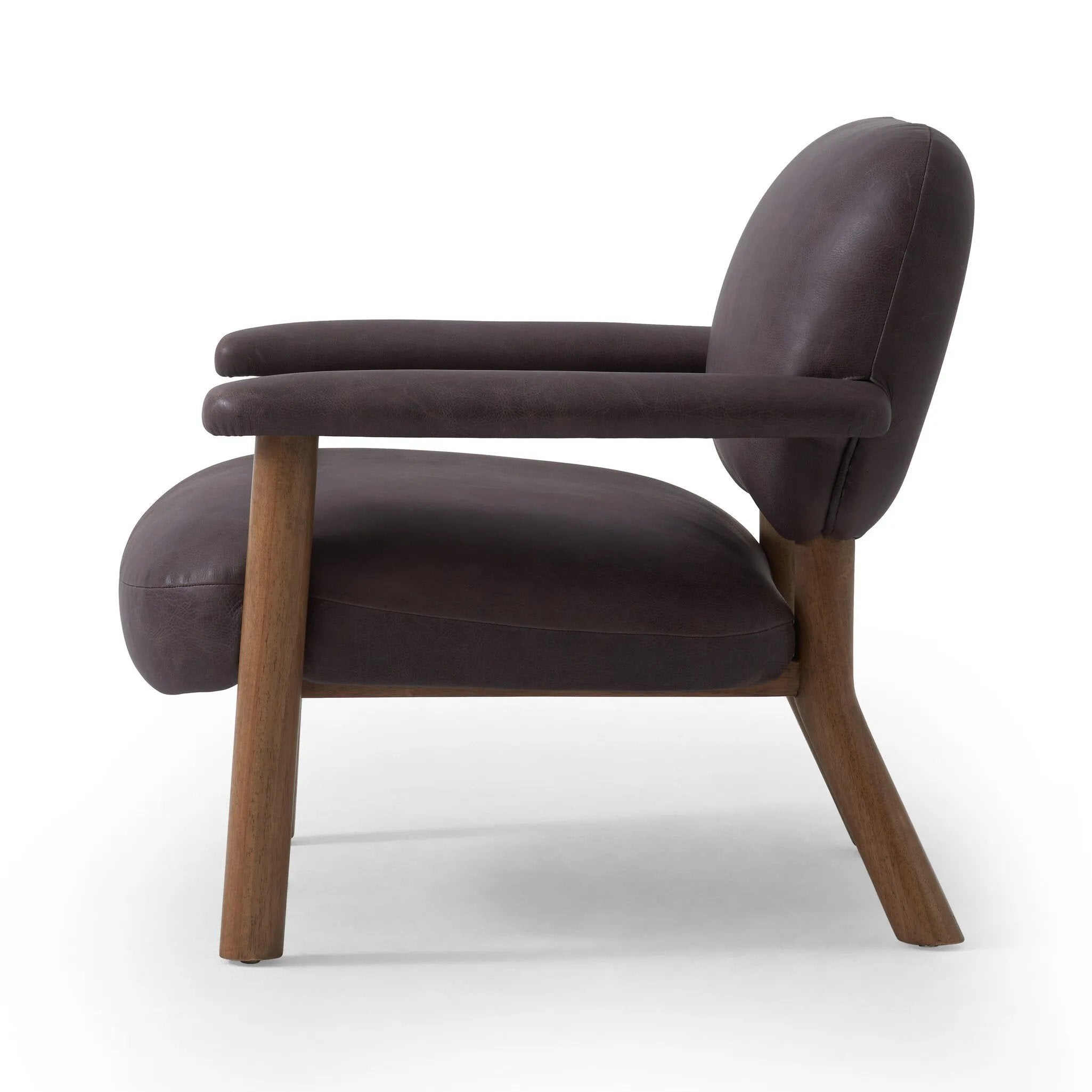 Sleek and inviting, this wood-meets-leather arm chair is timeless in any context. Large cylindrical legs support the upholstered back and seat, which are covered in bark-colored top-grain leather. Spring suspension adds comfort and durability to the seat cushion.Collection: Carnegi Amethyst Home provides interior design, new home construction design consulting, vintage area rugs, and lighting in the Alpharetta metro area.