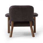 Sleek and inviting, this wood-meets-leather arm chair is timeless in any context. Large cylindrical legs support the upholstered back and seat, which are covered in bark-colored top-grain leather. Spring suspension adds comfort and durability to the seat cushion.Collection: Carnegi Amethyst Home provides interior design, new home construction design consulting, vintage area rugs, and lighting in the Kansas City metro area.