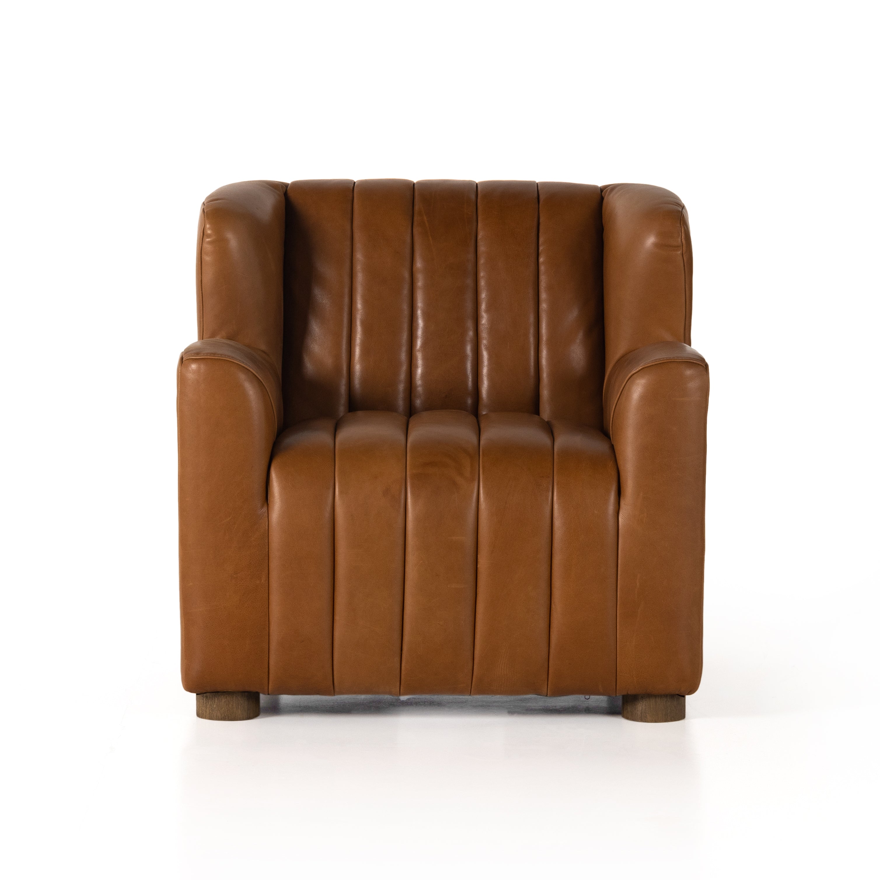 The classic wing-back club chair adopts heavy channeling for an even-comfier sit. Tobacco top-grain leather brings this retro lounge-inspired chair up to modern speed. Amethyst Home provides interior design, new construction, custom furniture, and area rugs in the Laguna Beach metro area.