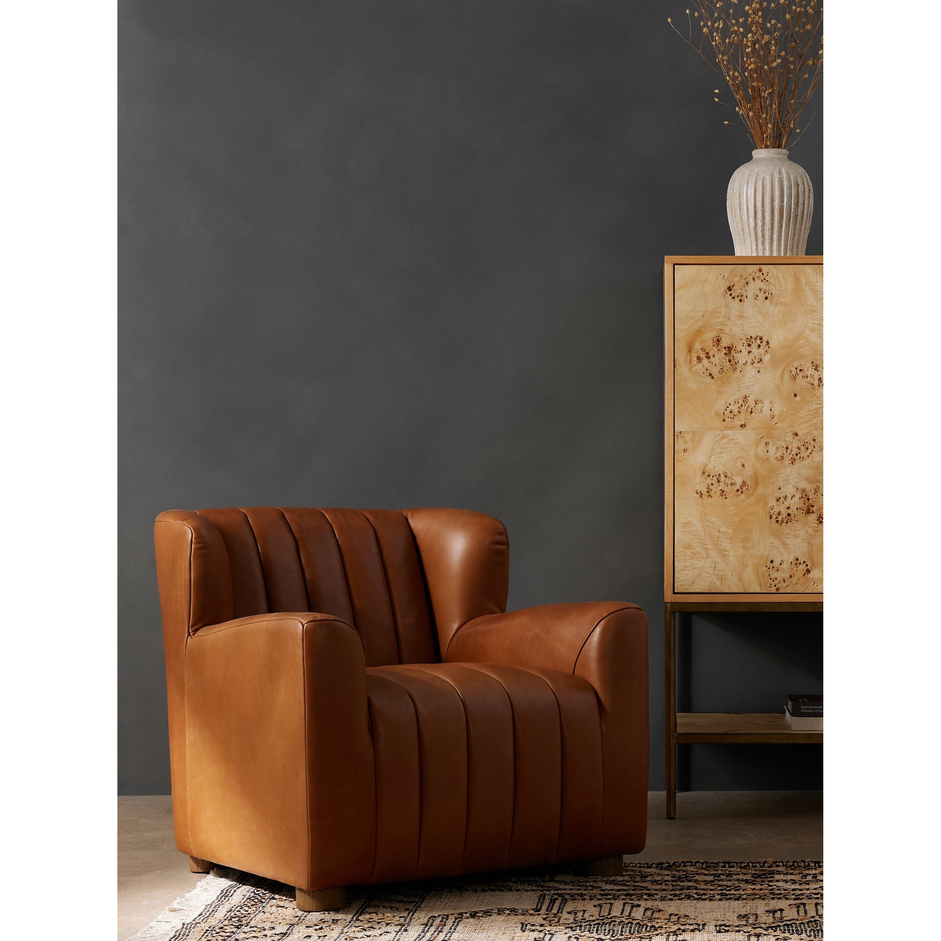 The classic wing-back club chair adopts heavy channeling for an even-comfier sit. Tobacco top-grain leather brings this retro lounge-inspired chair up to modern speed. Amethyst Home provides interior design, new construction, custom furniture, and area rugs in the Newport Beach metro area.
