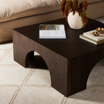 Clean and simple, with great impact. Made from beautiful Guanacaste in a natural hue, shapely arches and block corners speak to the architectural inspiration behind this eye-catching coffee table. Amethyst Home provides interior design, new construction, custom furniture, and area rugs in the Los Angeles metro area.