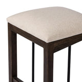 Featuring Finn Sienna Brown Oak Counter Stool by Four Hands at Amethyst Home. A stunner from every angle, this architecturally inspired stool features an angular base crafted from solid oak with two iron rods for added support and visual interest. Seat is upholstered in a linen/cotton/poly blend performance fabric with subtle texture throughout. Performance f. Amethyst Home provides interior design, new home construction design consulting, vintage area rugs, and lighting in the Houston metro area.
