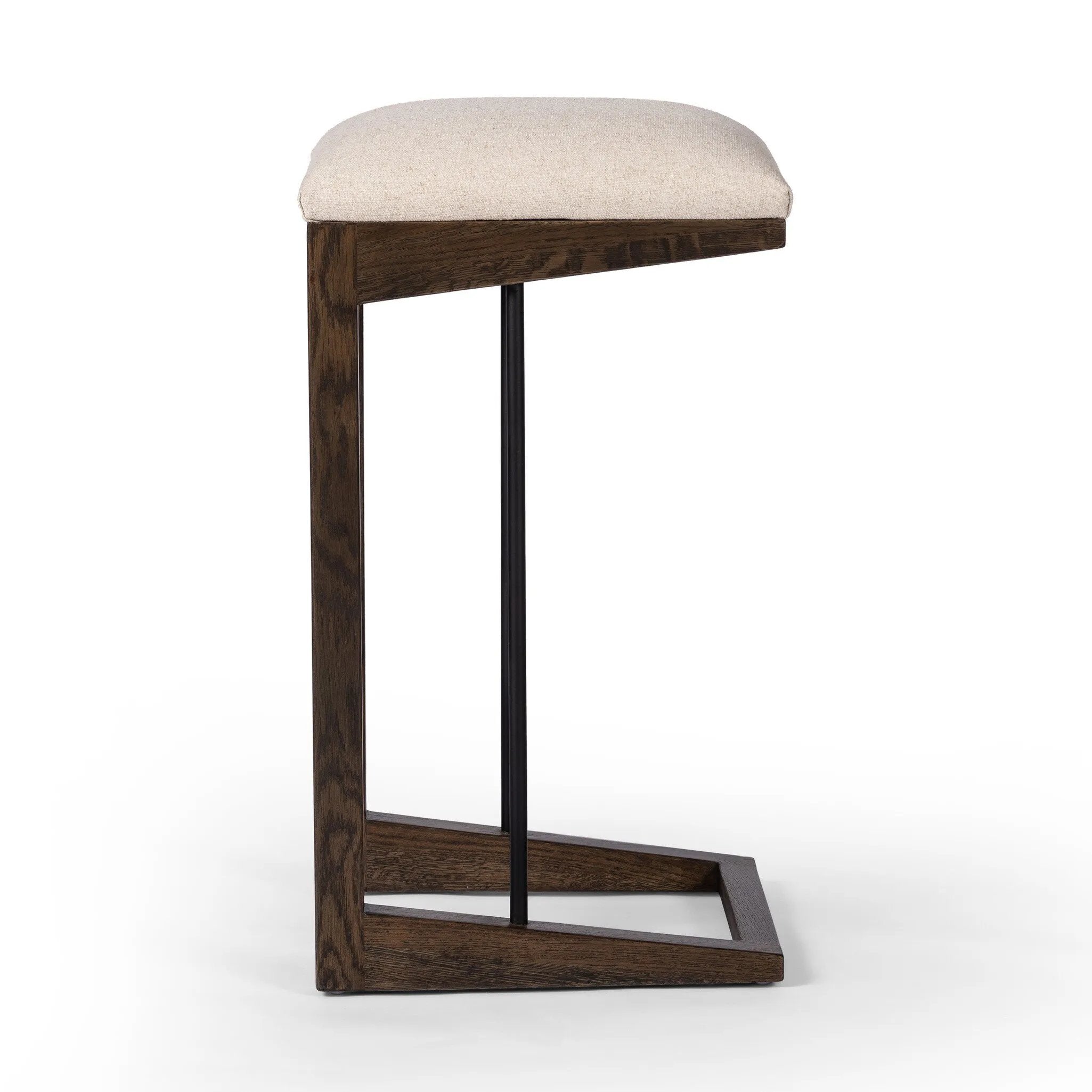 A stunner from every angle, this architecturally inspired stool features an angular base crafted from solid oak with two iron rods for added support and visual interest. Seat is upholstered in a linen/cotton/poly blend performance fabric with subtle texture throughout. Amethyst Home provides interior design, new home construction design consulting, vintage area rugs, and lighting in the Salt Lake City metro area.