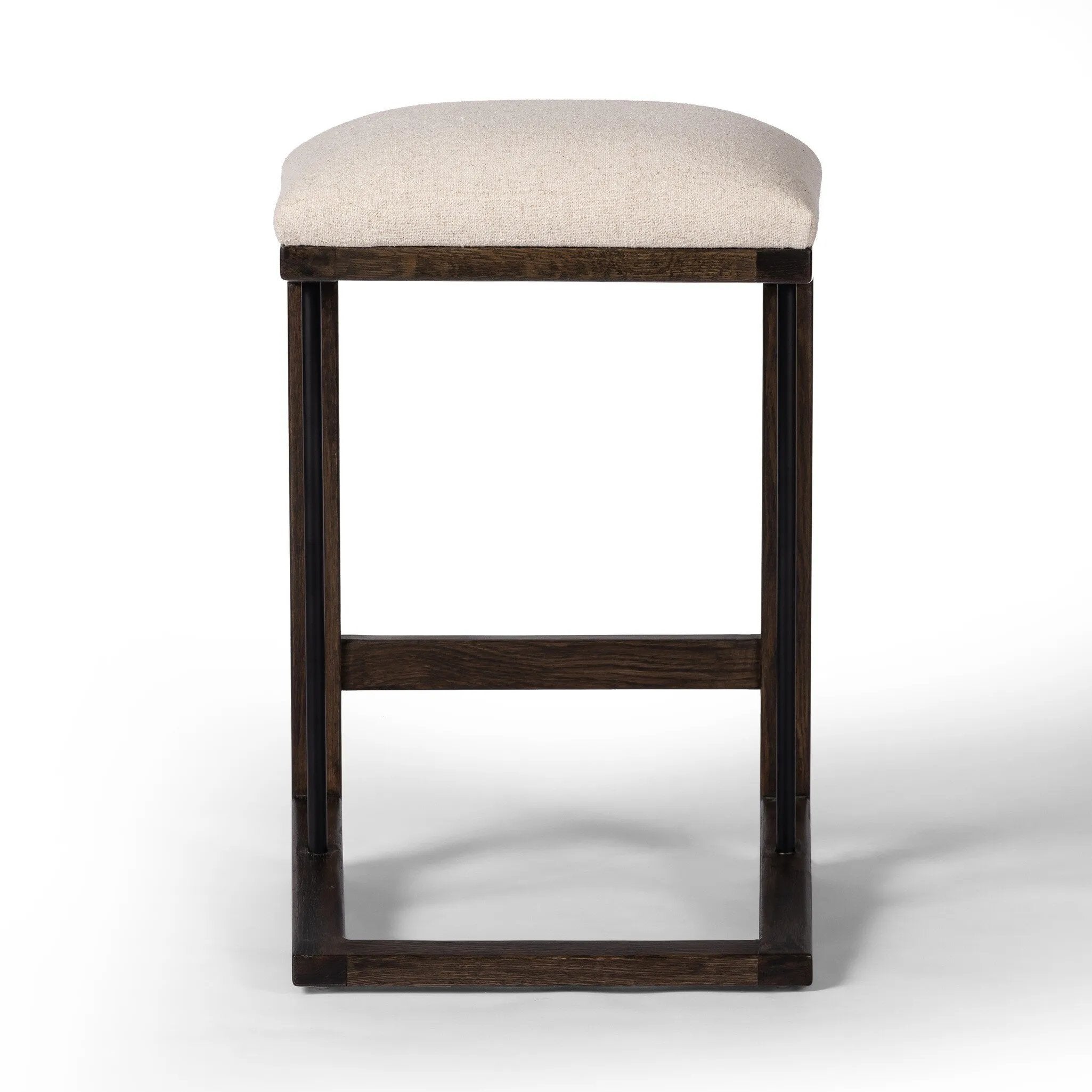 A stunner from every angle, this architecturally inspired stool features an angular base crafted from solid oak with two iron rods for added support and visual interest. Seat is upholstered in a linen/cotton/poly blend performance fabric with subtle texture throughout. Amethyst Home provides interior design, new home construction design consulting, vintage area rugs, and lighting in the Scottsdale metro area.