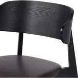 A fresh, exaggerated take on the wing-back dining chair. Finished a classic jet black, a mix of solid ash and ash veneer makes a modern and shapely seating statement with midcentury undertones. Complemented by a cushioned seat in black top-grain leather exclusive to Four Hands. Amethyst Home provides interior design, new construction, custom furniture, and area rugs in the Miami metro area.
