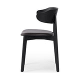 A fresh, exaggerated take on the wing-back dining chair. Finished a classic jet black, a mix of solid ash and ash veneer makes a modern and shapely seating statement with midcentury undertones. Complemented by a cushioned seat in black top-grain leather exclusive to Four Hands. Amethyst Home provides interior design, new construction, custom furniture, and area rugs in the San Diego metro area.