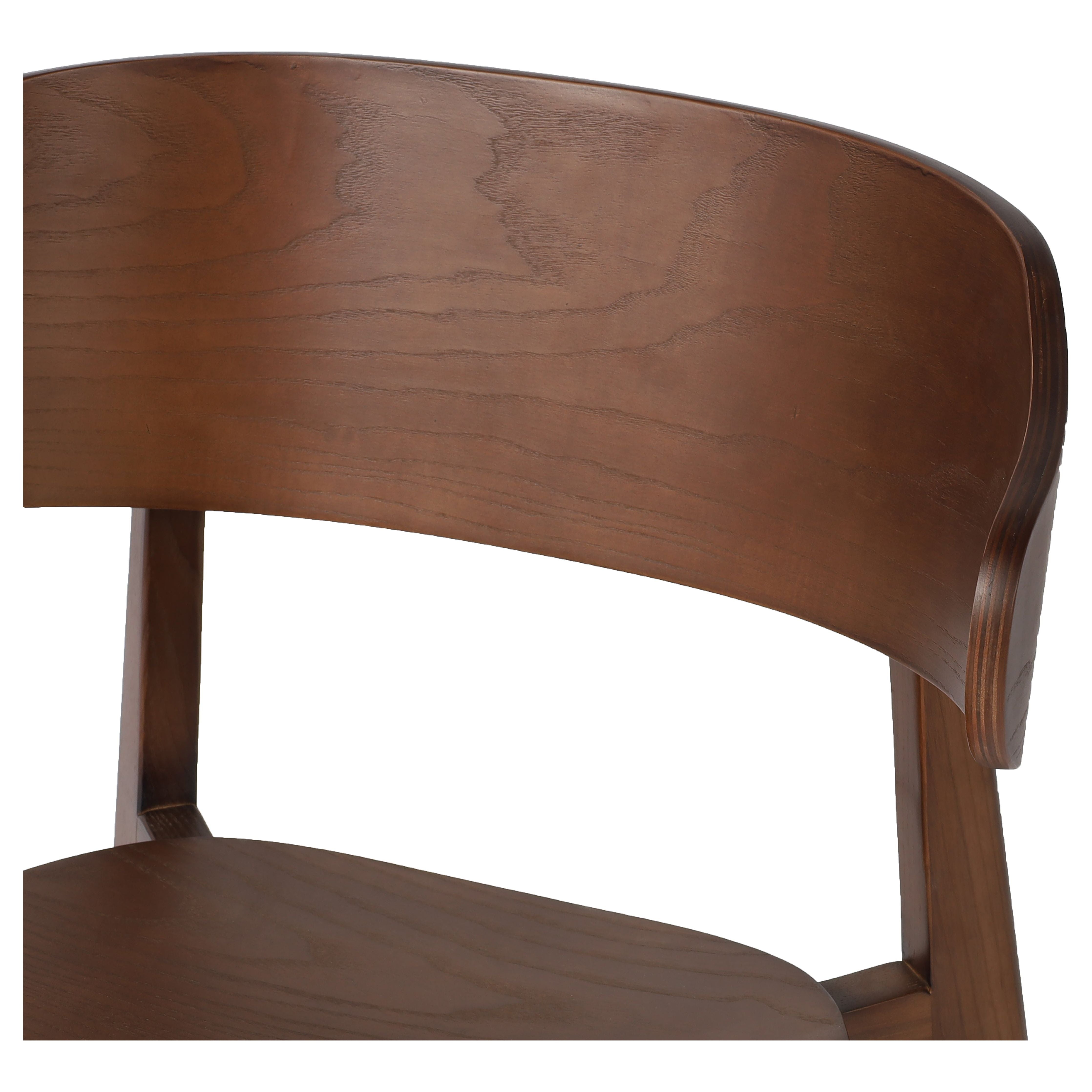 A fresh, exaggerated take on the wing-back dining chair. Finished in a natural hue, a mix of solid ash and ash veneer makes a modern and shapely seating statement with mid-century undertones. Amethyst Home provides interior design, new construction, custom furniture, and area rugs in the Los Angeles metro area.