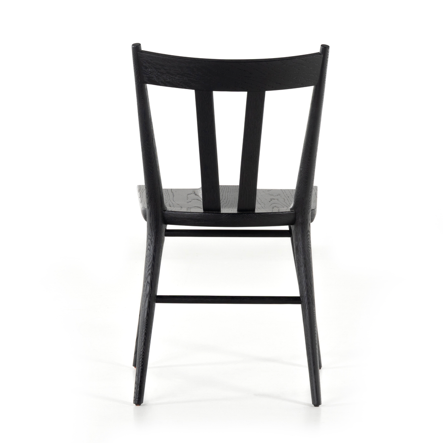 Finished in a beautifully classic black oak, the Gregory Black Oak Dining Chair features a yoke-like back and widened supports, placing a fresh twist on the traditional Windsor. Amethyst Home provides interior design, new construction, custom furniture, and rugs for the Chicago metro area.