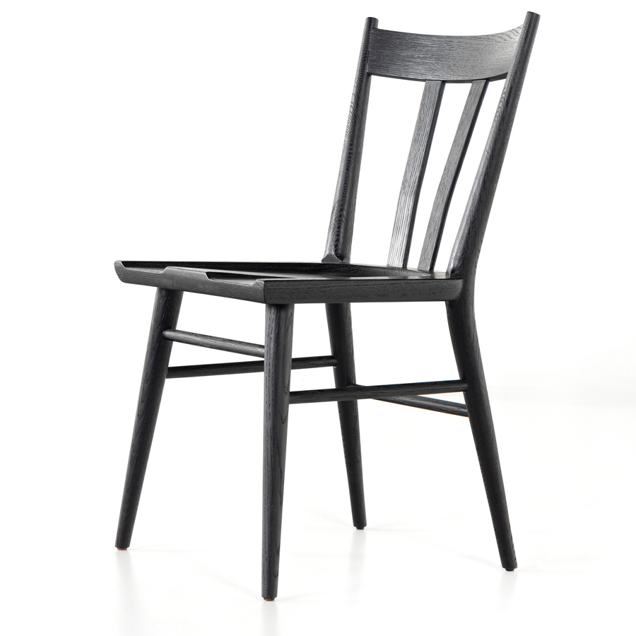 Finished in a beautifully classic black oak, the Gregory Black Oak Dining Chair features a yoke-like back and widened supports, placing a fresh twist on the traditional Windsor. Amethyst Home provides interior design, new construction, custom furniture, and rugs for the Nashville metro area.