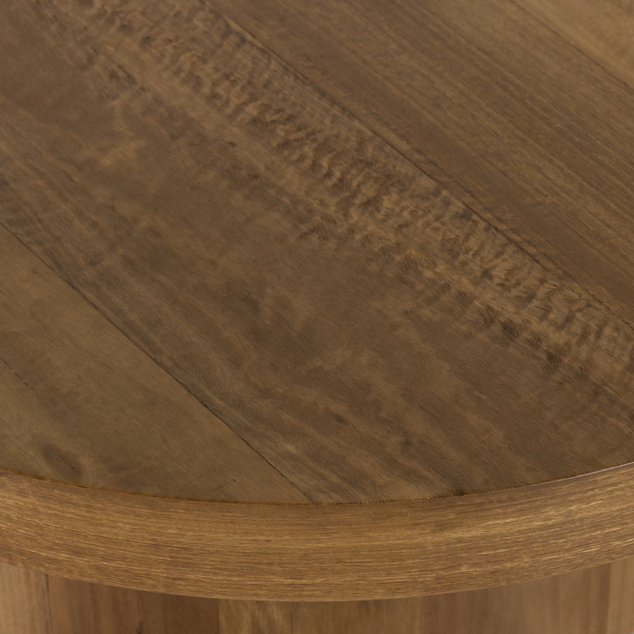 Stunning forces of nature are captured in a drum-style pedestal coffee table, natural yukas veneer is hand-shaped into a beautifully rounded silhouette for a warm, natural ombre look. Reflective of woods' natural character, a slight color variance is possible from piece to piece. Amethyst Home provides interior design, new home construction design consulting, vintage area rugs, and lighting in the Salt Lake City metro area.