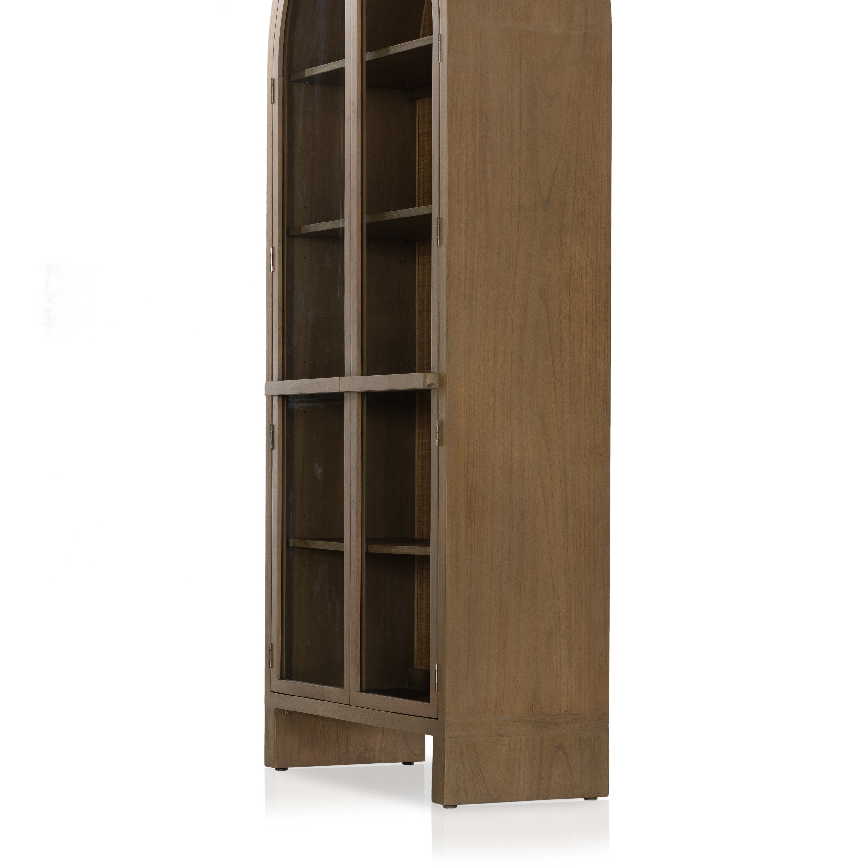 Ilana Burnished Mindi Cabinet forms a dramatic arch this glass-front cabinetry, with woven natural cane backing for a textural finishing touch. Amethyst Home provides interior design services, furniture, rugs, and lighting in the Charlotte metro area.