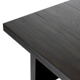 A substantially sized coffee table of smoked black oak features joint and connection construction for a design-forward look. Visible knots and graining add character.Collection: Haide Amethyst Home provides interior design, new home construction design consulting, vintage area rugs, and lighting in the Charlotte metro area.