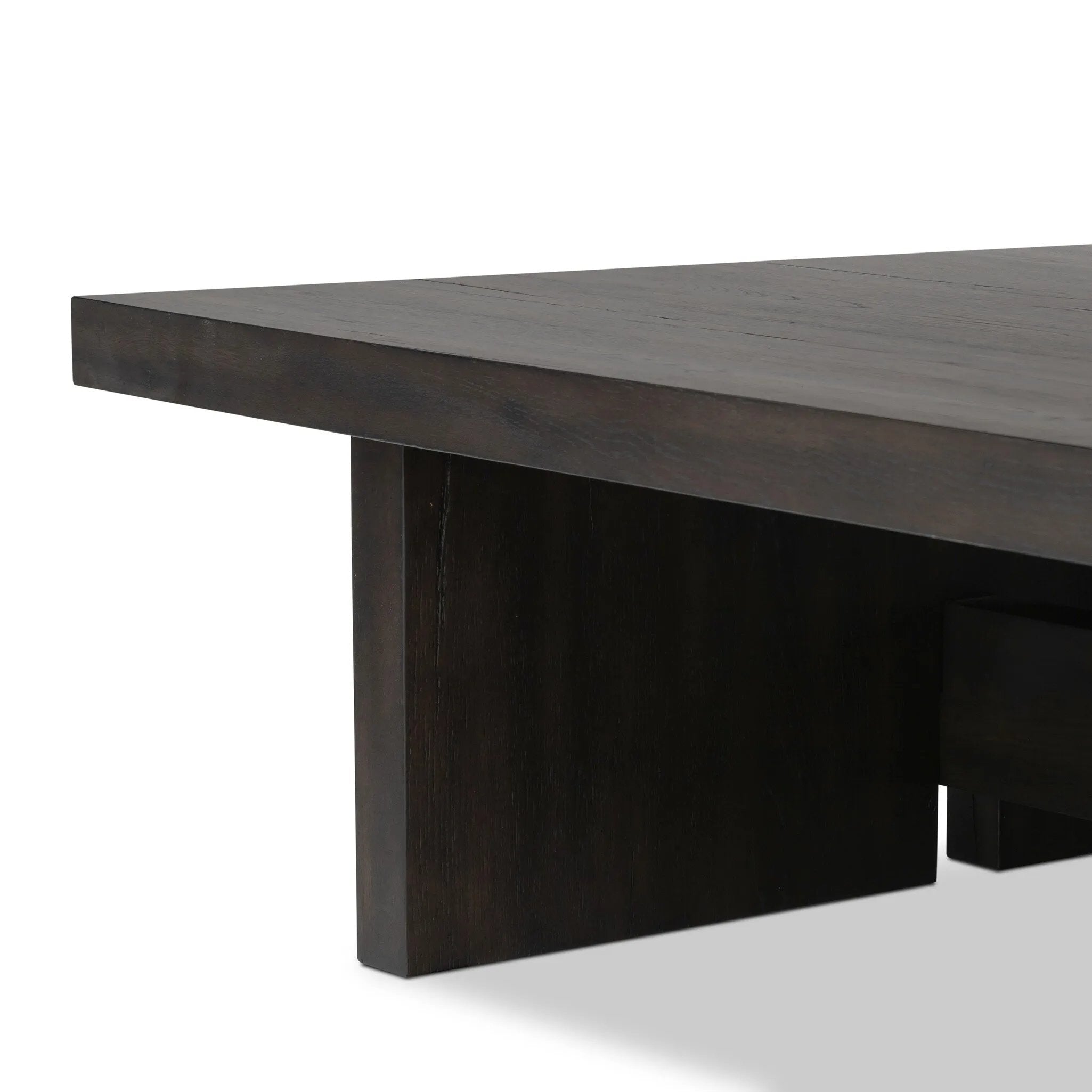A substantially sized coffee table of smoked black oak features joint and connection construction for a design-forward look. Visible knots and graining add character.Collection: Haide Amethyst Home provides interior design, new home construction design consulting, vintage area rugs, and lighting in the Winter Garden metro area.