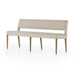 Simply styled and midcentury-minded, Joseph Light Camel Dining Bench is a textural light taupe upholstery that features a posterior cutout for added flair, with toasted nettlewood legs for natural contrast. Amethyst Home provides interior design services, furniture, rugs, and lighting in the Austin metro area. 