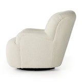 Kadon Natural Swivel Chair is a high wing back pairs with softly rolled arms for a curvy look and supportive sit. Cream-colored shearling-upholstered seating tops a 360-degree swivel. Amethyst Home provides interior design services, furniture, rugs, and lighting in the Des Moines metro area.