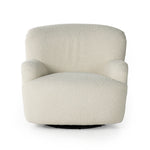 Kadon Natural Swivel Chair is a high wing back pairs with softly rolled arms for a curvy look and supportive sit. Cream-colored shearling-upholstered seating tops a 360-degree swivel. Amethyst Home provides interior design services, furniture, rugs, and lighting in the Monterey metro area.