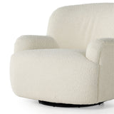 Kadon Natural Swivel Chair is a high wing back pairs with softly rolled arms for a curvy look and supportive sit. Cream-colored shearling-upholstered seating tops a 360-degree swivel. Amethyst Home provides interior design services, furniture, rugs, and lighting in the Seattle metro area.