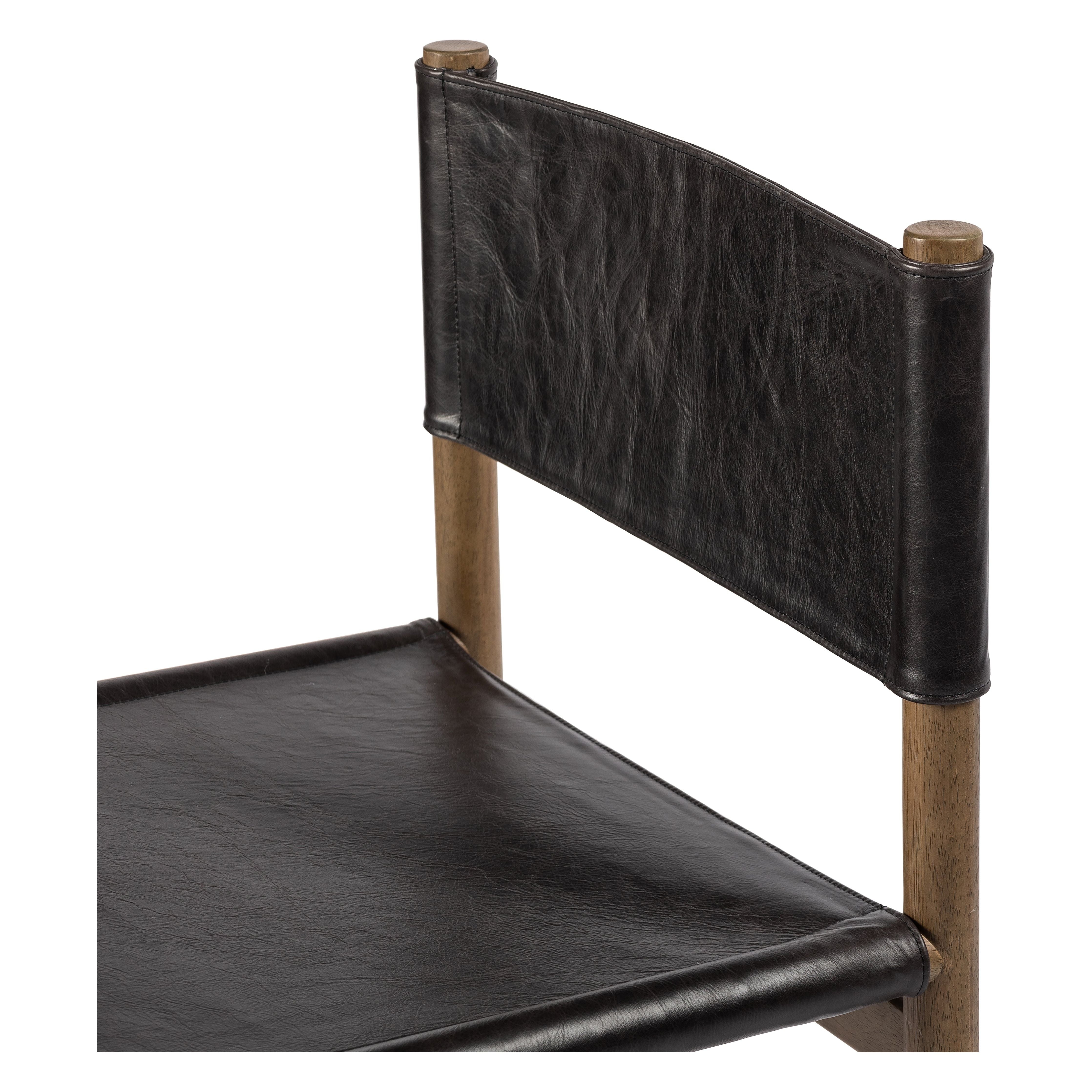 Solid parawood forms a simple, vintage-inspired frame for sling-style seating of black top-grain leather exclusive to Four Hands. Amethyst Home provides interior design, new construction, custom furniture, and area rugs in the Miami metro area.