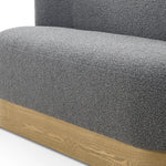 Style takes shape. Comfortably curved bench seating is upholstered in a chunky charcoal boucle, with water-repellent high-performance fabric for modern sensibility. A plinth-style ash veneer base works casual contrast into the mix. Perfectly sized for a cozy breakfast nook; pair up to suit a larger space. Amethyst Home provides interior design, new home construction design consulting, vintage area rugs, and lighting in the Austin metro area.