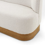 Style takes shape. Comfortably curved bench seating is upholstered in a chunky off-white boucle, with water-repellent performance fabric for a modern touch. A plinth-style ash veneer base works casual contrast into the mix. Perfectly sized for a cozy breakfast nook; pair up to suit a larger space. Amethyst Home provides interior design, new home construction design consulting, vintage area rugs, and lighting in the Salt Lake City metro area.