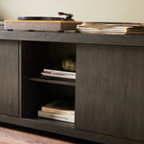 Inspired by European antiques, black-finished oak veneer features cracks and weathering for a character-rich look. Sliding doors open to reveal generous storage space for media, with rear cutouts to keep your cords out of sight Amethyst Home provides interior design, new home construction design consulting, vintage area rugs, and lighting in the Nashville metro area.