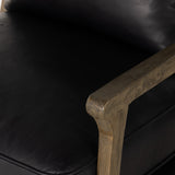 A solid frame of warm oak features a high, ladder back design for a regal air. Upholstered in heirloom black leather. Sourced from one of the oldest family-owned tanneries in Italyâ€™s Bassano del Grappa, heirloom leather is salvaged and processed from upcycled hides featuring an abundance of natural markings, scars and color variations. Amethyst Home provides interior design, new construction, custom furniture, and area rugs in the Kansas City metro area.