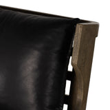 A solid frame of warm oak features a high, ladder back design for a regal air. Upholstered in heirloom black leather. Sourced from one of the oldest family-owned tanneries in Italyâ€™s Bassano del Grappa, heirloom leather is salvaged and processed from upcycled hides featuring an abundance of natural markings, scars and color variations. Amethyst Home provides interior design, new construction, custom furniture, and area rugs in the Nashville metro area.