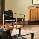 This material-driven take on safari styling features black heirloom leather. With a tufted sling-style seat, strap arm and pivot back, this vintage-feeling accent chair makes a chic statement wherever it's styled. Amethyst Home provides interior design, new construction, custom furniture, and area rugs in the Salt Lake City metro area.