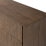 Designed by Thomas Bina and Ronald Sasson, a design partnership blending both modern minimalist and Brazilian influences. Crafted from solid oak, this clean-lined dresser features vertical reed detailing on the drawer fronts with wooden pull detailing on the outer edges. Drawers are finished with soft close under-mount drawer glides.Collection: Bin Amethyst Home provides interior design, new home construction design consulting, vintage area rugs, and lighting in the Kansas City metro area.