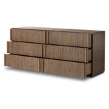Designed by Thomas Bina and Ronald Sasson, a design partnership blending both modern minimalist and Brazilian influences. Crafted from solid oak, this clean-lined dresser features vertical reed detailing on the drawer fronts with wooden pull detailing on the outer edges. Drawers are finished with soft close under-mount drawer glides.Collection: Bin Amethyst Home provides interior design, new home construction design consulting, vintage area rugs, and lighting in the Newport Beach metro area.