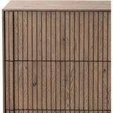 Designed by Thomas Bina and Ronald Sasson, a design partnership blending both modern minimalist and Brazilian influences. Crafted from solid oak, this clean-lined dresser features vertical reed detailing on the drawer fronts with wooden pull detailing on the outer edges. Drawers are finished with soft close under-mount drawer glides.Collection: Bin Amethyst Home provides interior design, new home construction design consulting, vintage area rugs, and lighting in the Winter Garden metro area.