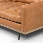 Low-leaning style with mid-century vibes. Upholstered in an exclusive subtly distressed butterscotch top-grain leather, with button tufting for texture and comfort. Finished with wrap-around framing and cone-tapered legs. Amethyst Home provides interior design, new construction, custom furniture, and area rugs in the Miami metro area.