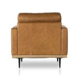 Low-leaning style with midcentury vibes. Upholstered in an exclusive subtly distressed butterscotch top-grain leather, with button tufting for texture and comfort. Finished with wrap-around framing and cone-tapered legs. Amethyst Home provides interior design, new construction, custom furniture, and area rugs in the Dallas metro area.