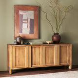 Inspired by Swedish folk design, natural elm crafts the frame and panel structure of this sideboard. Designed without hardware, the raised panels of the doors have a cutout to serve as handles, offering a clean appearance that offers practical function. Amethyst Home provides interior design, new construction, custom furniture, and area rugs in the Boston metro area.