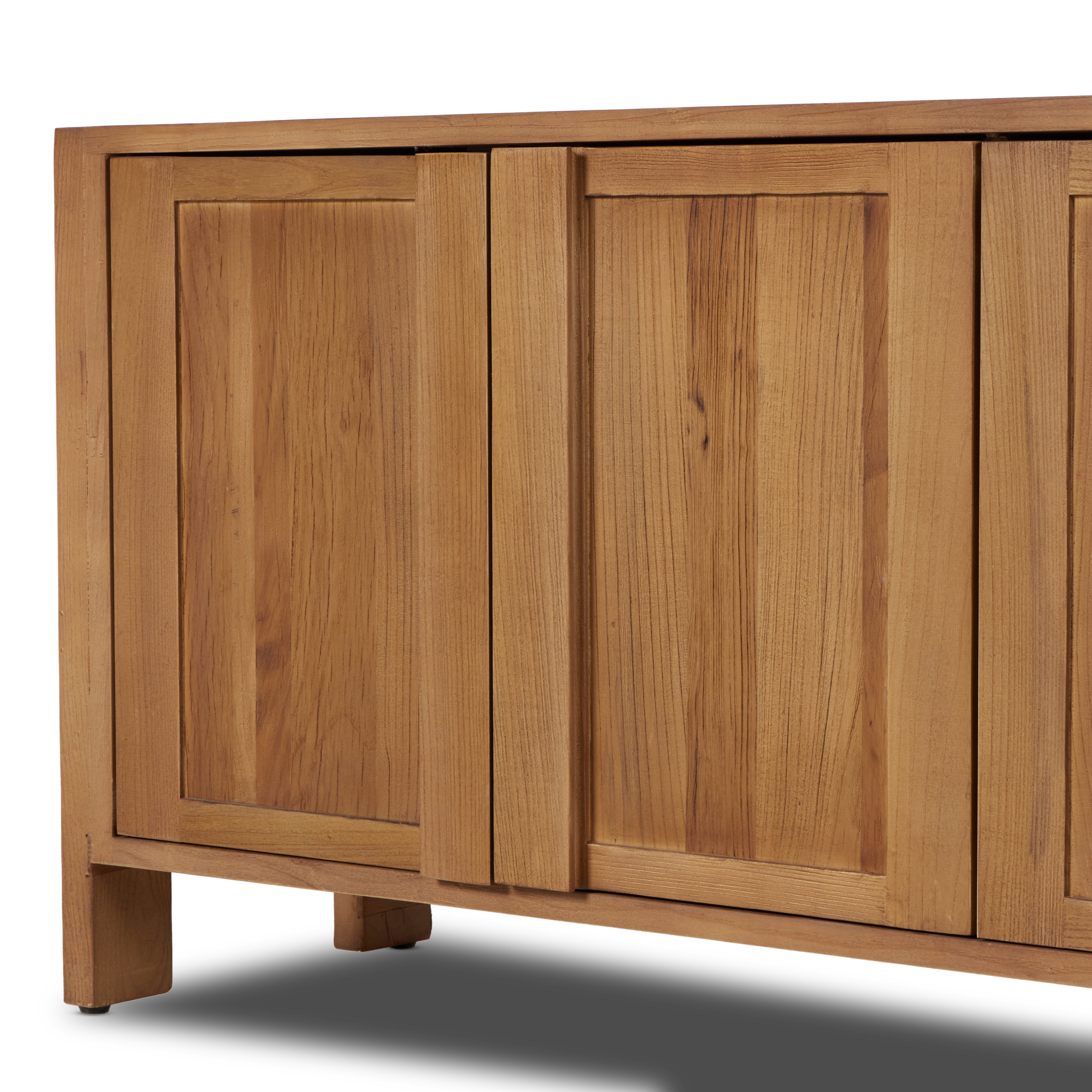 Inspired by Swedish folk design, natural elm crafts the frame and panel structure of this sideboard. Designed without hardware, the raised panels of the doors have a cutout to serve as handles, offering a clean appearance that offers practical function. Amethyst Home provides interior design, new construction, custom furniture, and area rugs in the Laguna Beach metro area.