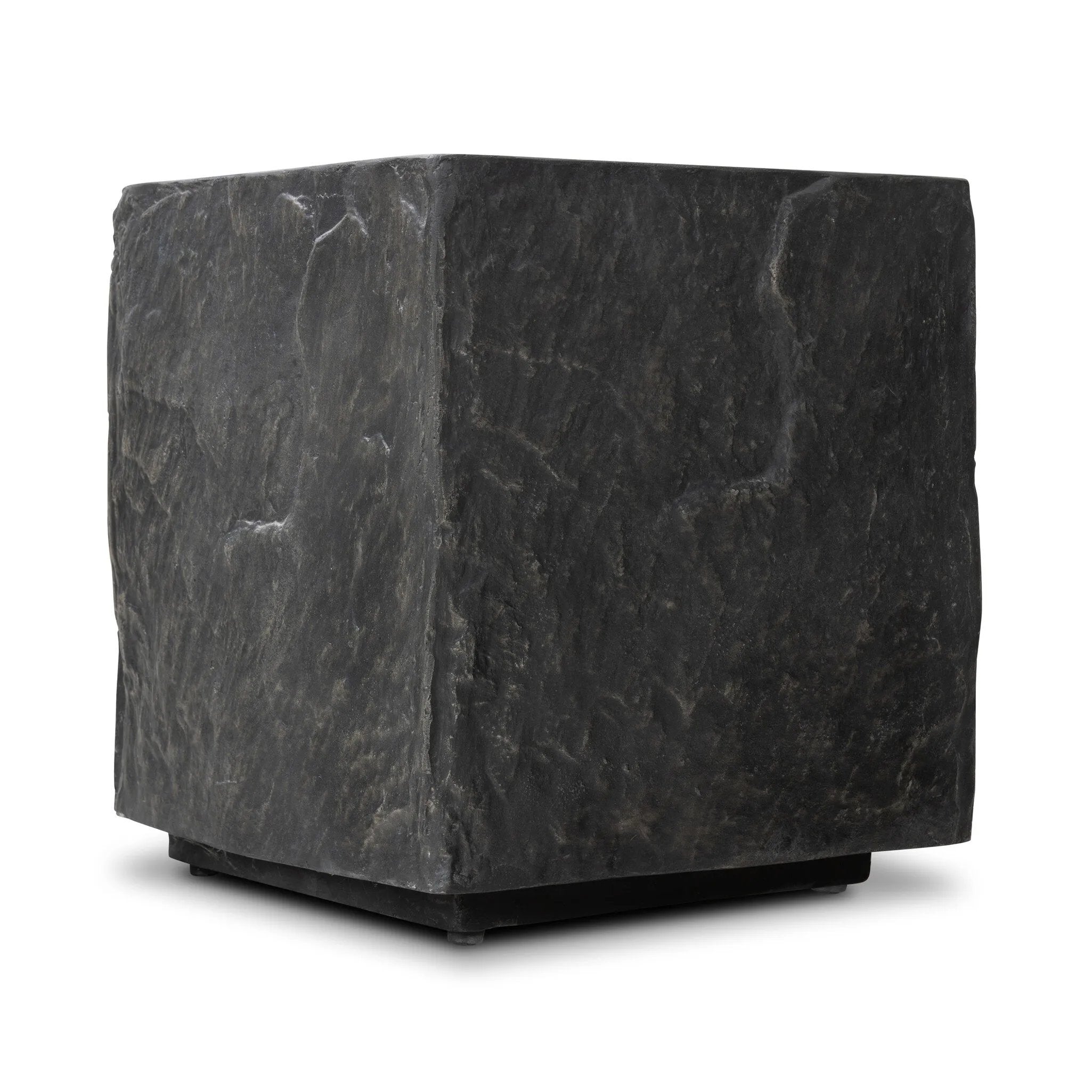 Cast black concrete features heavily textured sides that resemble natural slate, paired with a smoothed tabletop.Collection: Chandle Amethyst Home provides interior design, new home construction design consulting, vintage area rugs, and lighting in the Laguna Beach metro area.