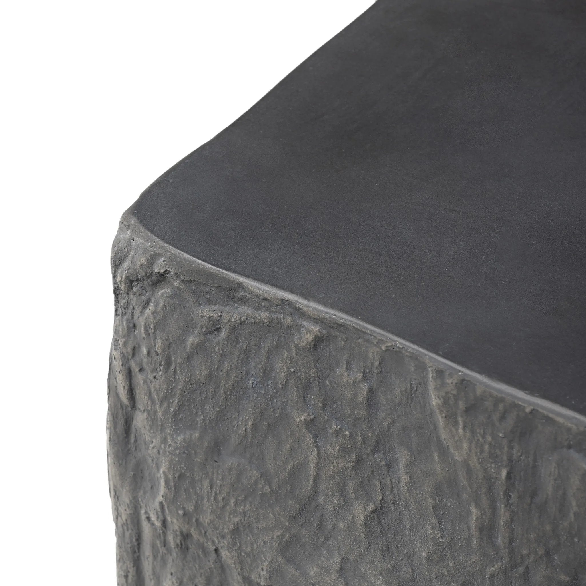 Cast black concrete features heavily textured sides that resemble natural slate, paired with a smoothed tabletop.Collection: Chandle Amethyst Home provides interior design, new home construction design consulting, vintage area rugs, and lighting in the Los Angeles metro area.