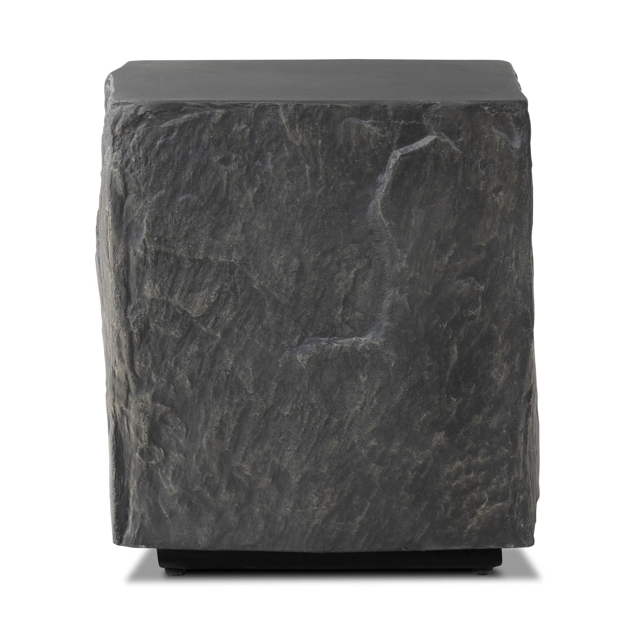 Cast black concrete features heavily textured sides that resemble natural slate, paired with a smoothed tabletop.Collection: Chandle Amethyst Home provides interior design, new home construction design consulting, vintage area rugs, and lighting in the Nashville metro area.