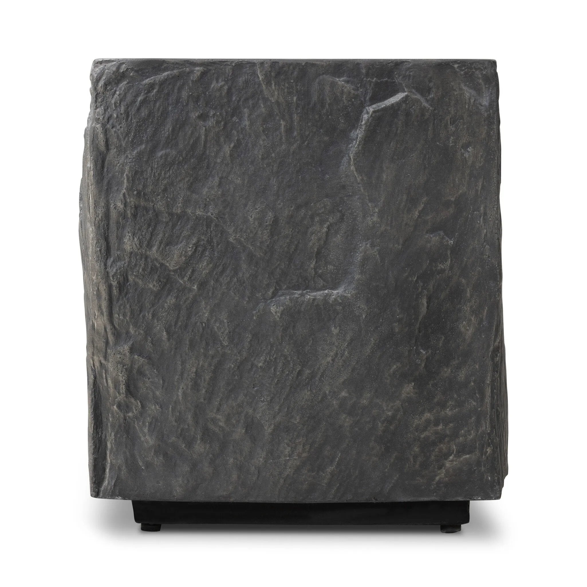Cast black concrete features heavily textured sides that resemble natural slate, paired with a smoothed tabletop.Collection: Chandle Amethyst Home provides interior design, new home construction design consulting, vintage area rugs, and lighting in the Washington metro area.
