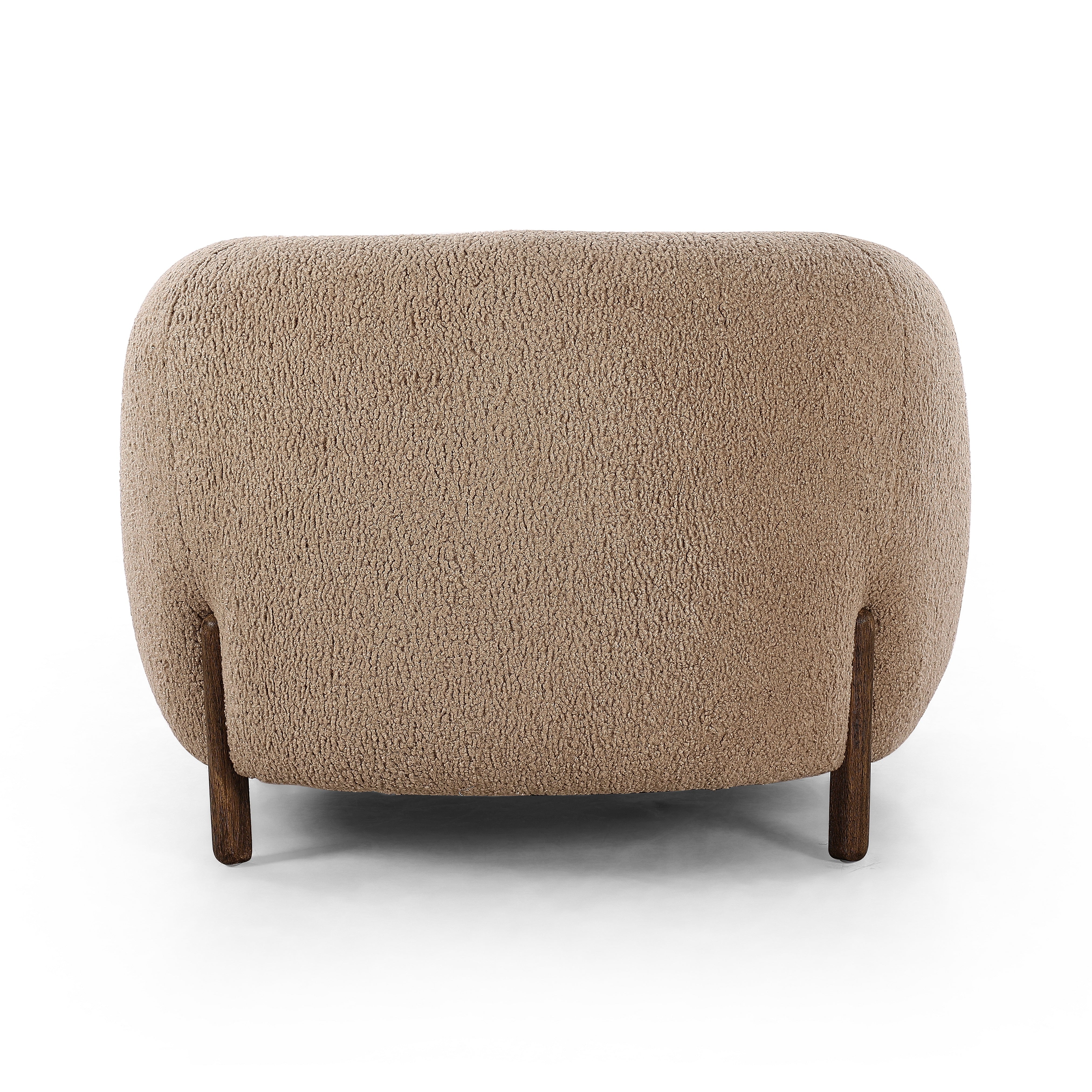 Lyla Sheepskin Camel Chair is a fresh take on the traditional tub chair, with exaggerated depth for drama and comfort. Solid wood legs intersect sheepskin upholstery for clean contrast and scale. Amethyst Home provides interior design services, furniture, rugs, and lighting in the Kansas City metro area.