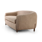 Lyla Sheepskin Camel Sofa is a fresh, elongated take on the traditional tub chair, with exaggerated depth for drama and comfort. Solid wood legs intersect sheepskin upholstery on this plush sofa for clean contrast and scale. Amethyst Home provides interior design services, furniture, rugs, and lighting in the Calabasas metro area.