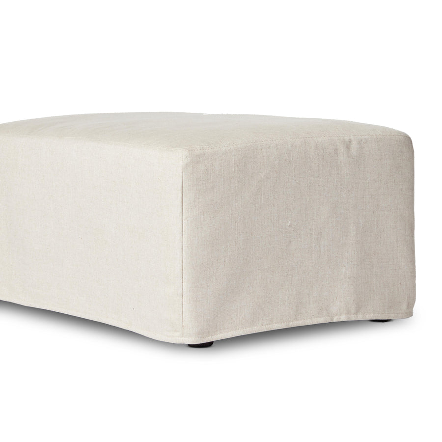 Proudly built by American makers using US-sourced materials. This classic ottoman features down feather-blend cushioning for the ultimate seating experience. Upholstered with a fully removable slipcover of PFAS-free performance fabric that can be dry-cleaned for easy care. Amethyst Home provides interior design, new home construction design consulting, vintage area rugs, and lighting in the Des Moines metro area.