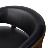 This floating wrap chair features an exposed wood profile that cradles seat and back cushions, all upholstered in black top-grain leather. The frame feels fluid, as it travels from the ground to the upholstered back rest and back down through the hind legs. Spring suspension ensures stylish comfort.Collection: Farro Amethyst Home provides interior design, new home construction design consulting, vintage area rugs, and lighting in the Kansas City metro area.