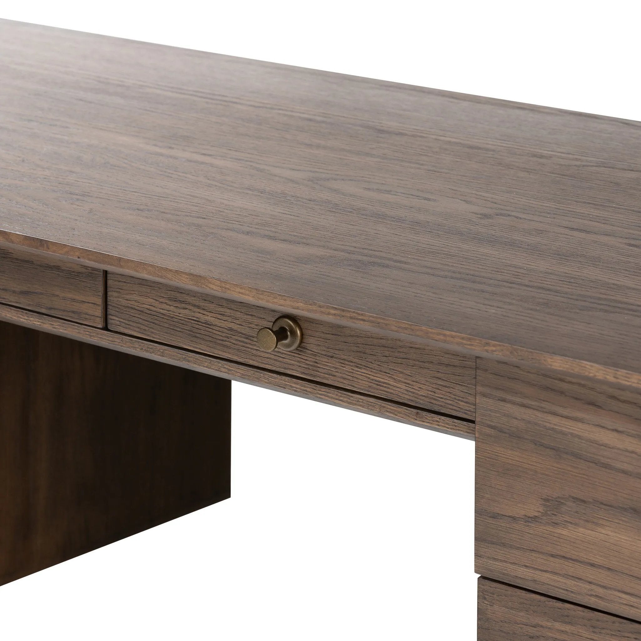 An executive-style desk of aged oak, inspired by European antiques. Turned, cylindrical legs adapt this charming heirloom-inspired piece for the modern home office and beyond.Collection: Haide Amethyst Home provides interior design, new home construction design consulting, vintage area rugs, and lighting in the Laguna Beach metro area.