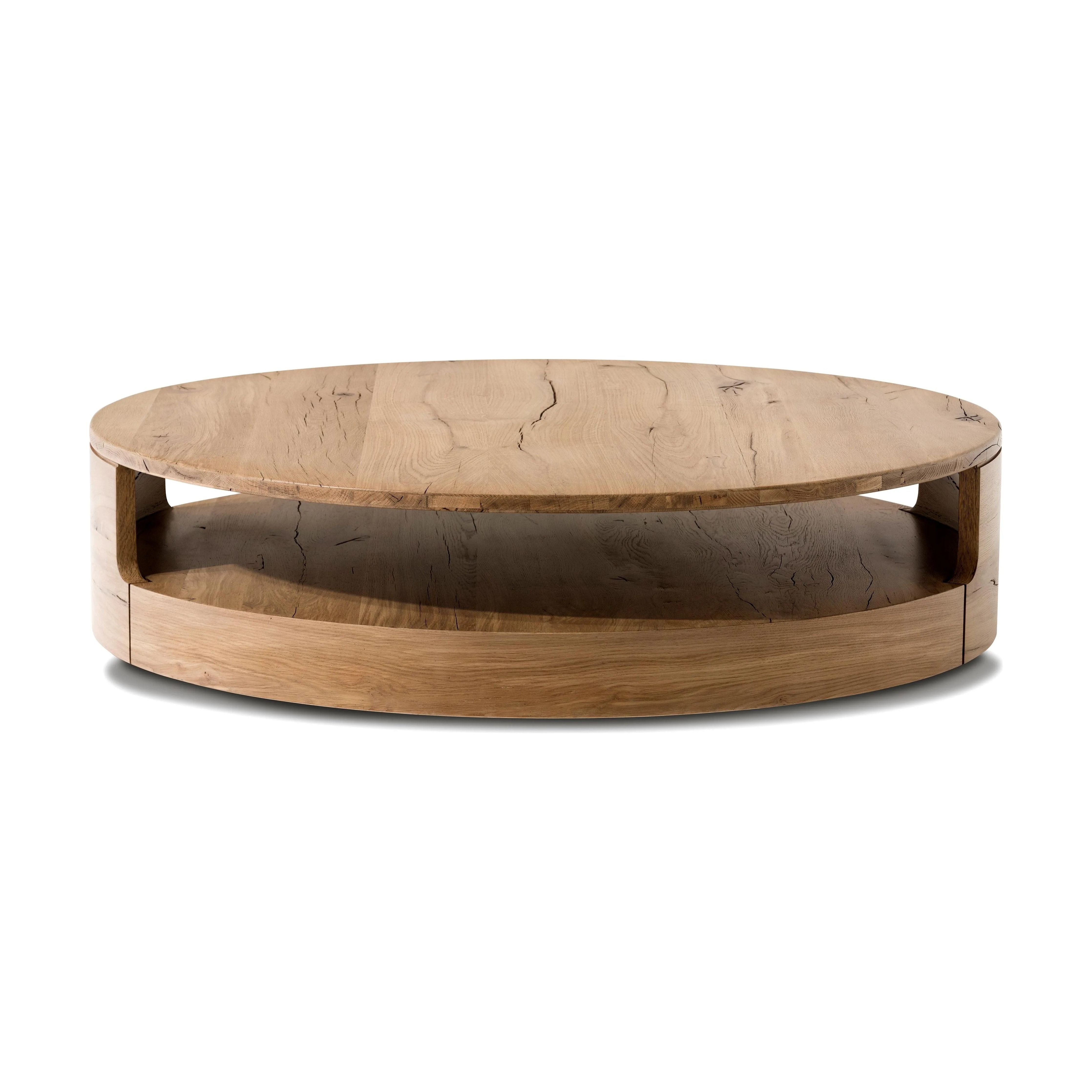 Designed in partnership with longtime Four Hands collaborator Thomas Bina and Brazilian designer Ronald Sasson. A rounded coffee table made from reclaimed French oak, features beautiful natural graining. Lower layer lightens the whole look, while brining the option for bonus storage or display.Collection: Bin Amethyst Home provides interior design, new home construction design consulting, vintage area rugs, and lighting in the Dallas metro area.