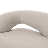 A fluid play on seating. This statement making sofa features subtle cutouts on the back with plush arms that hug the bench seat. Upholstered in a tight, wool-like textile for a polished look.Collection: Grayso Amethyst Home provides interior design, new home construction design consulting, vintage area rugs, and lighting in the Boston metro area.