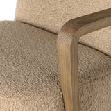 A comfort-driven desk chair features soft, textural upholstery in a versatile camel, framed by solid ash arms. A height-adjustable swivel base with casters makes for ease in the modern office. Amethyst Home provides interior design, new home construction design consulting, vintage area rugs, and lighting in the Calabasas metro area.