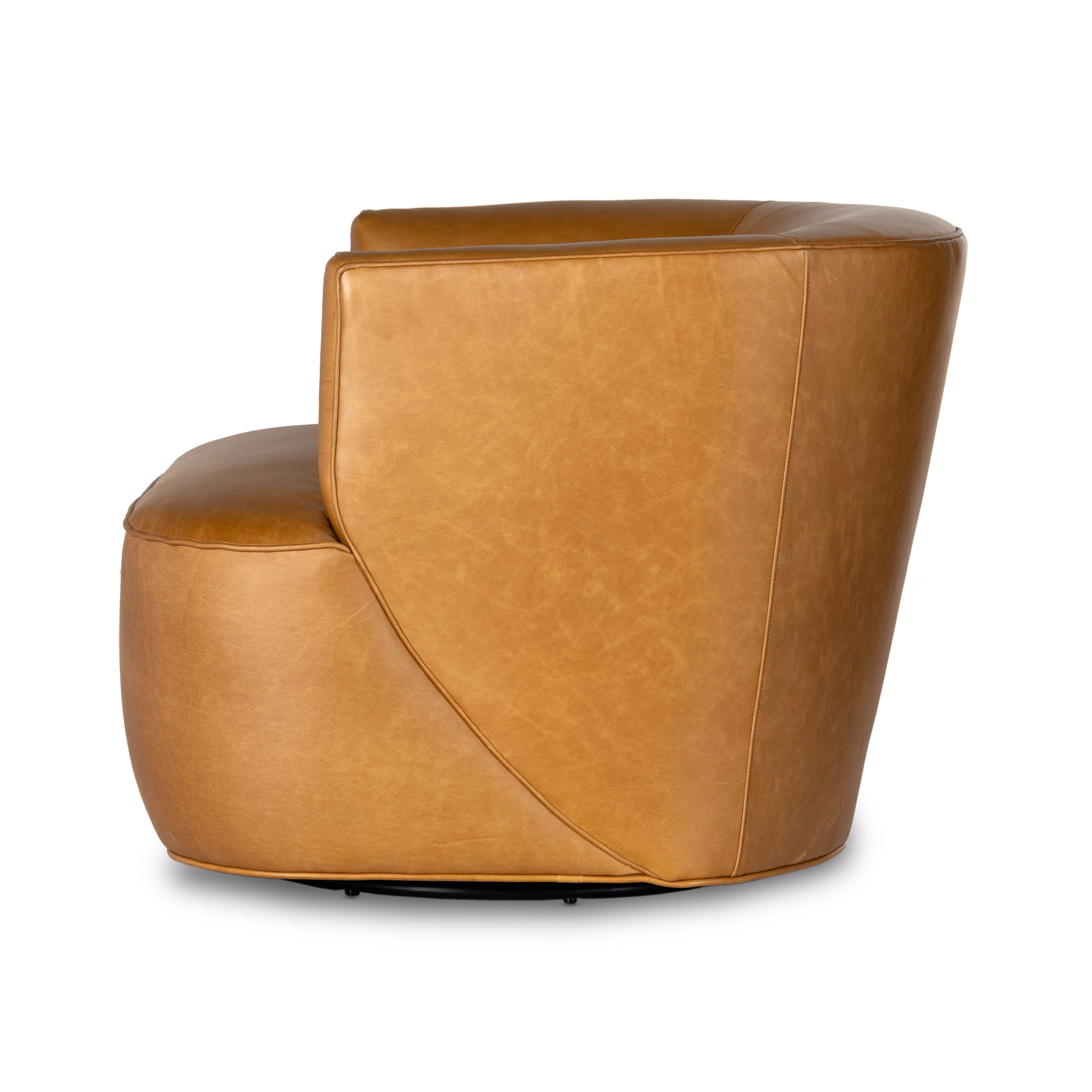 Supple, camel-colored top-grain leather hugs the curves of this modern-shaped seat, featuring a hidden 360-degree swivel. Amethyst Home provides interior design, new construction, custom furniture, and area rugs in the Boston metro area.