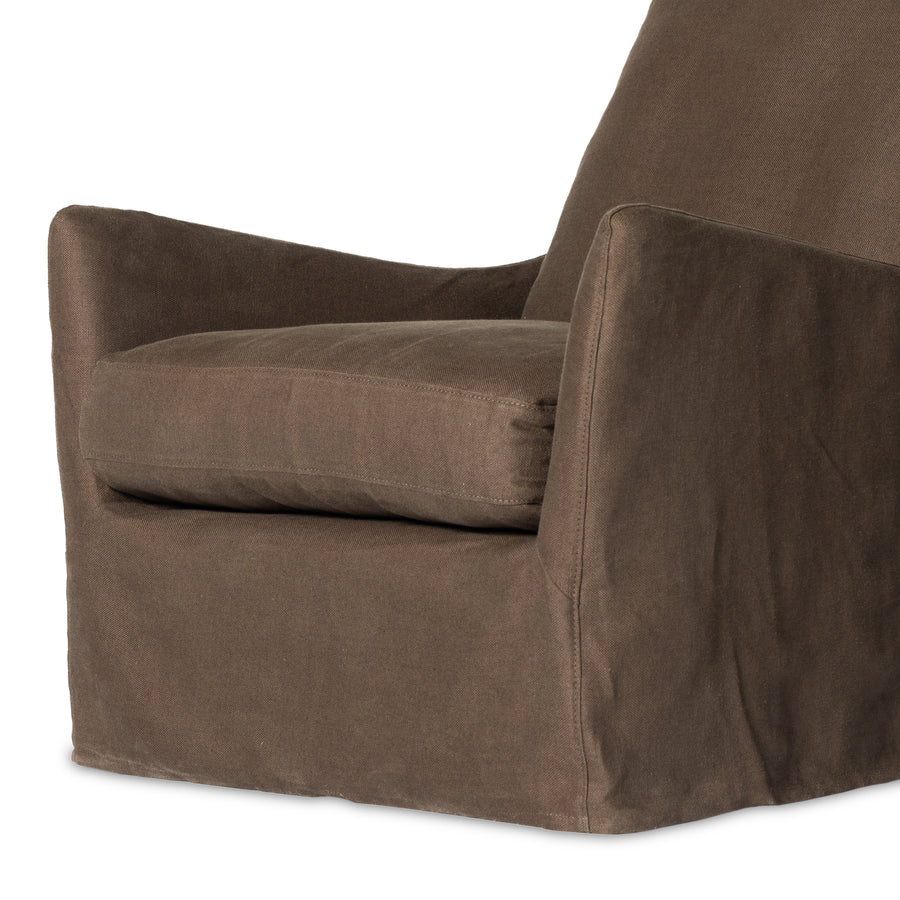 This 360-degree swivel chair is defined by slightly sloping, flared arms and a floor-length slipcover. Finished in a soft, tight weave slipcover for a traditional style. Durable and soft to the touch, Libeco™-sourced linens are artisan-made and free of toxic chemicals. Slipcovered styles are fully removable and machine-washable for easy care. Amethyst Home provides interior design, new home construction design consulting, vintage area rugs, and lighting in the Charlotte metro area.