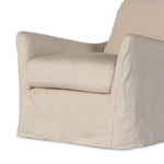 This 360-degree swivel chair is defined by slightly sloping, flared arms and a floor-length slipcover. Finished in a soft, tight weave slipcover for a traditional style. Durable and soft to the touch, Libecoâ„¢-sourced linens are artisan-made and free of toxic chemicals. Slipcovered styles are fully removable and machine-washable for easy care. Amethyst Home provides interior design, new construction, custom furniture and area rugs in the Charlotte metro area